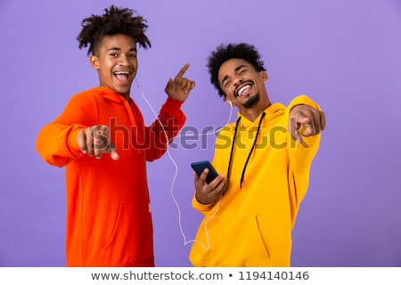 Stockfoto: Two Happy Male African Friends In Colorful Hoodies