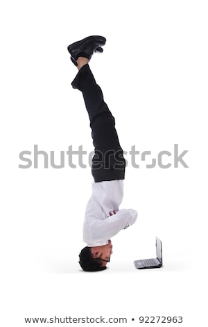 Stock photo: A Man Works At The Computer Upside Down