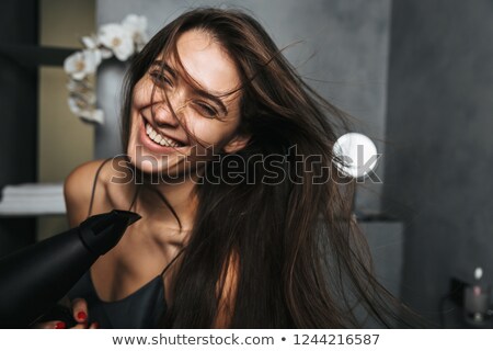 Zdjęcia stock: Photo Of Joyful Woman With Long Dark Hair And Healthy Skin Dryin