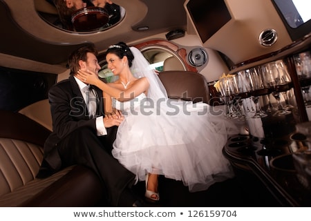Stock fotó: Handsome Couple Hugging In A Luxury Limousine