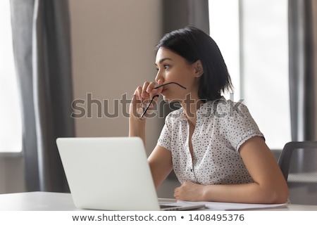 Сток-фото: Person Works On Laptop Sitting On A Question