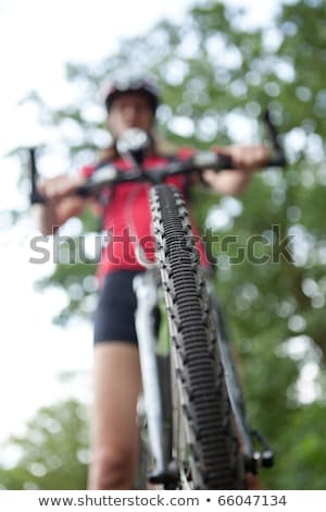 Сток-фото: Pretty Young Female Biker Outddors On Her Mountain Bike Shallow