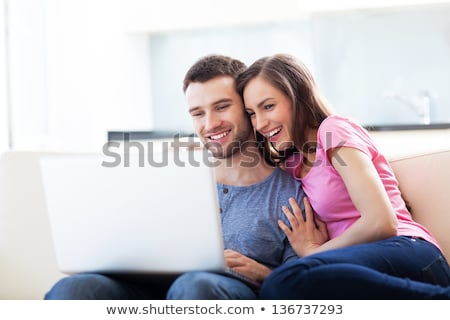 Stock foto: Couple With Laptop In Bed