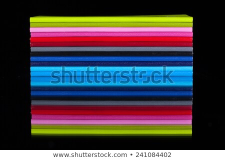 Foto stock: Twelve Different Colors Diaries On A Glass Desk