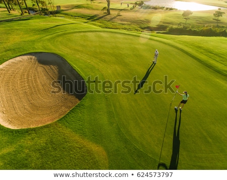 Foto stock: Golfer Taking A Bunker Shot