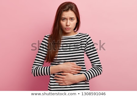 Foto stock: Woman Suffering From Stomachache