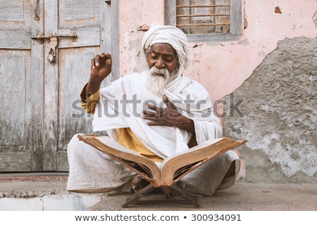 Сток-фото: Old Indian Sadhu Reading Scriptures