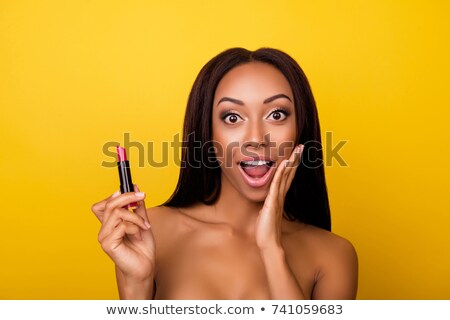 Zdjęcia stock: Girl Applying Lipstick
