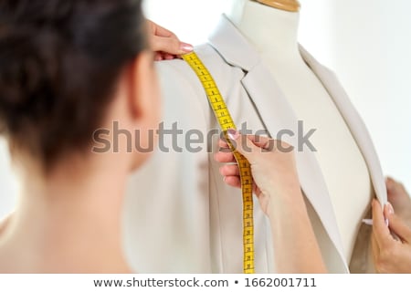 Stock fotó: Fashion Designer With Dummy Making Dress At Studio