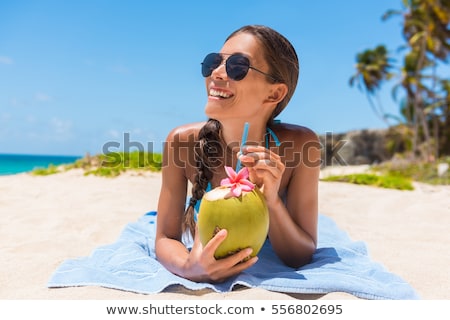 Сток-фото: Woman In Bikini Drinking The Coconut Water At Beach