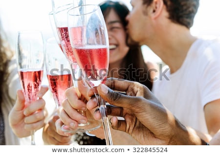 Foto stock: Happy Friends Celebrating Special Occasion Together On Beach At