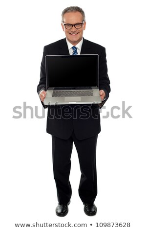 Foto stock: Aged Businessman Showing Newly Launched Laptop