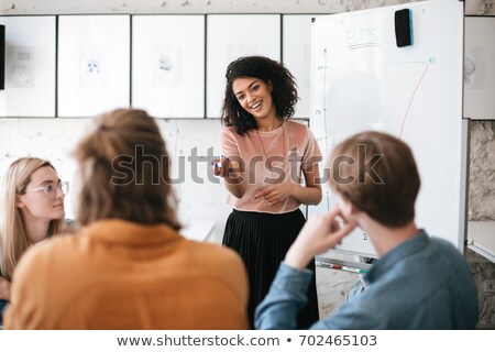 Foto d'archivio: Woman With Dark Hair And White Board