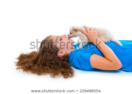 Stockfoto: Relaxed Kid Girl Kissing Puppy Chihuahua Dog Lying