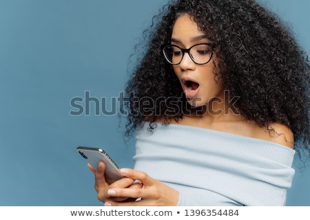 Stock foto: Shocked African American Woman Gots Message From Ex Gasps From Surprise And Excitement Reads Stunn