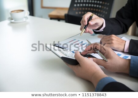 Foto d'archivio: Two Businessmen Checking Calculations