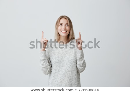 ストックフォト: Astonished Woman Looking And Pointing Upwards