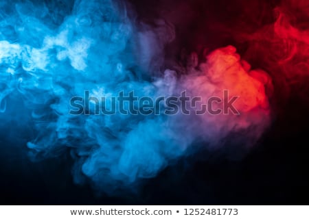 [[stock_photo]]: Pink And Blue Colored Smoke Pattern On Black