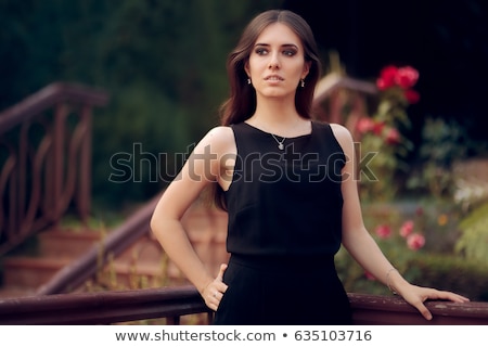 Stock fotó: Elegant Woman Wearing Black Dress Standing In A Patio