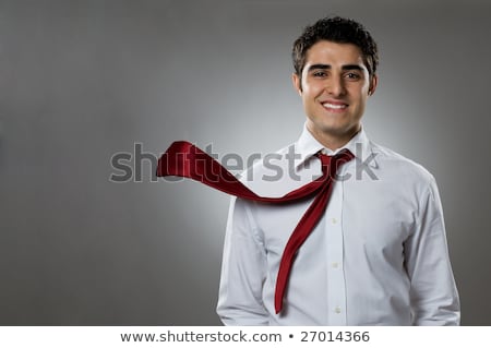 Сток-фото: Young Businessman Smiling With Blowing Necktie