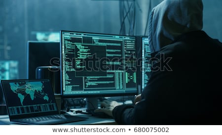 Foto stock: Hooded Computer Hacker Hacking Network