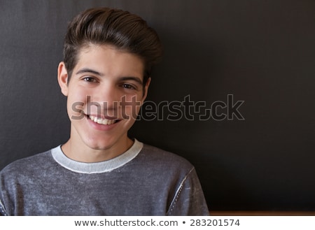 Foto stock: Head And Shoulders Of A Smiling Teenage Boy