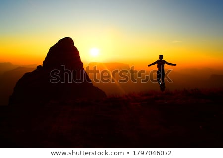 Foto stock: Boy Jumping On Hill