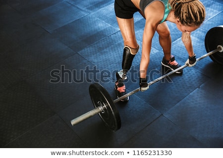 Stockfoto: Portrait Of European Invalid Woman With Prosthesis In Tracksuit