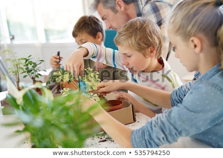 ストックフォト: Students And Teacher With Plant At Biology Class