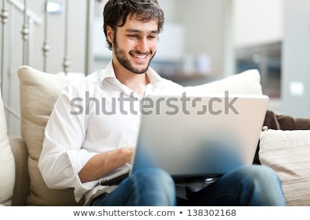 Stockfoto: Handsome Confident Young Man Relaxing At Home On The Sofa