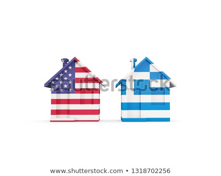 Foto d'archivio: Two Houses With Flags Of United States And Greece