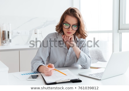 Stock photo: A Businesswoman With Documents And Pencil
