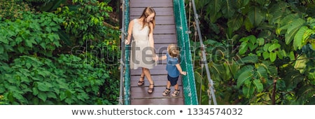 [[stock_photo]]: Mother And Son At The Suspension Bridge In Kuala Lumpur Malaysia