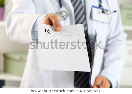 ストックフォト: Doctor Giving Prescription To Patient At Hospital