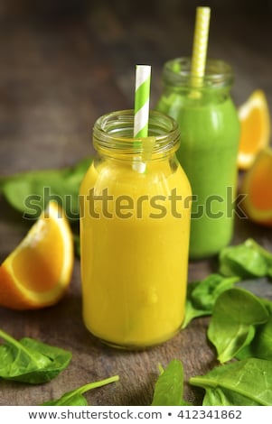 ストックフォト: Orange Juice In Glass Bottles With Paper Straws