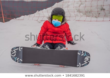 Foto stock: Little Cute Boy Snowboarding Activities For Children In Winter Childrens Winter Sport Lifestyle