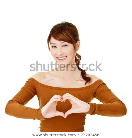 Foto d'archivio: Smiling Asian Woman Make Heart Shape