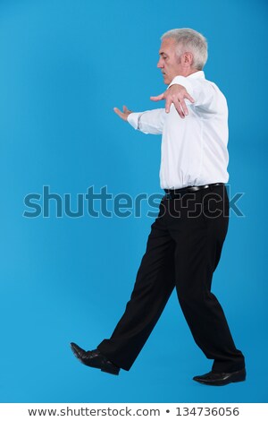 Stock fotó: Senior Man Walking A Tightrope