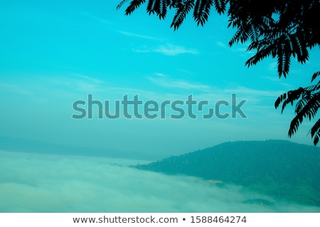 Zdjęcia stock: Mountain Peak Through The Clouds