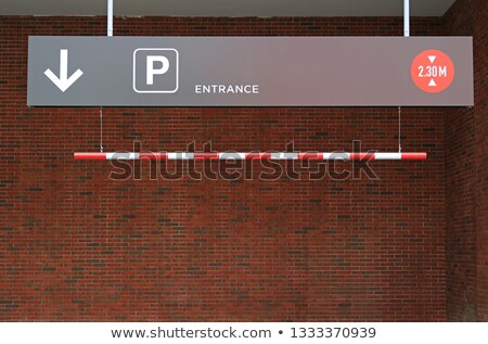 Foto stock: Car Parking Title On Brick Wall