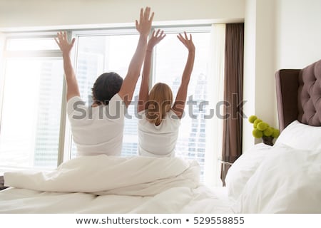 Zdjęcia stock: Two Young Beautiful Women Sitting On White Bed