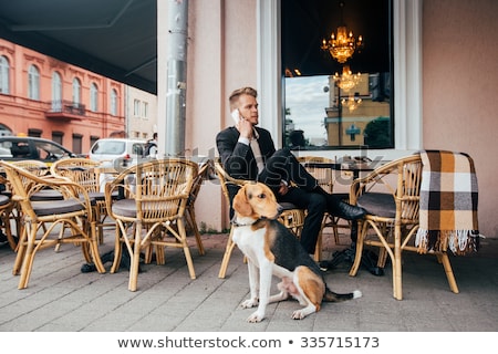 ストックフォト: Man And Dog Posing On The Street