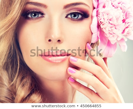 Stok fotoğraf: Beautiful Girl With Pink Makeup And Flowers