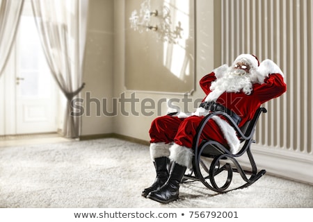 Stok fotoğraf: Santa Claus Sitting On Red Bag Isolated Christmas And New Year