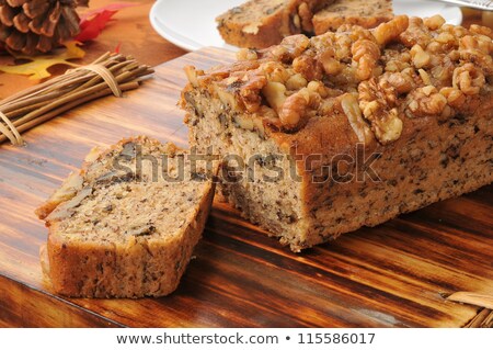 Stok fotoğraf: Walnuts And Pine Nuts On A Cutting Board