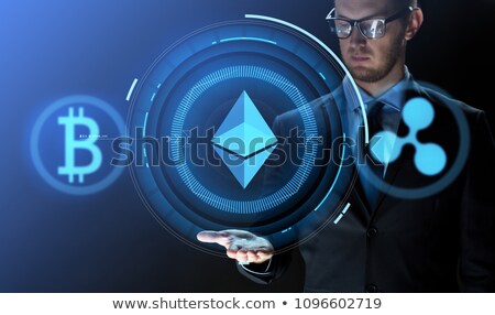 Foto stock: Businessman With Ethereum Hologram Over Black