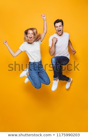 Foto stock: Portrait Of An Excited Young Couple