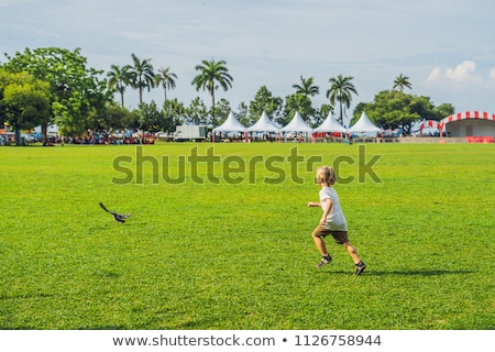 Stock photo: Boy On Padang Kota Lama Or Simply Called The Padang Is The Parade Ground And Playing Field Created