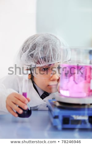Smart Cute Little Male Child Experimenting With Test Tubes In Real Modern Hospital Lab Stock fotó © Zurijeta