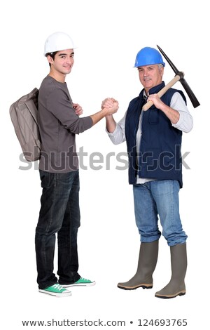 Foto stock: Apprentice And Senior Bricklayer Isolated On White